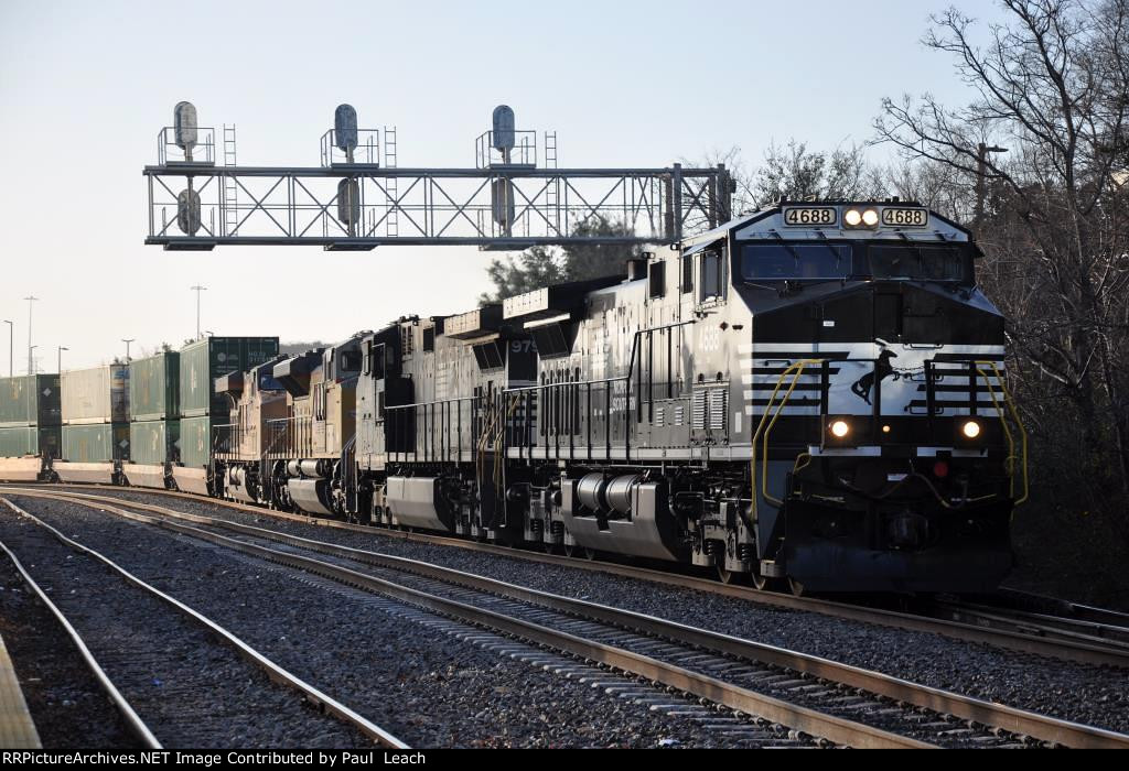 Westbound intermodal passes past the station